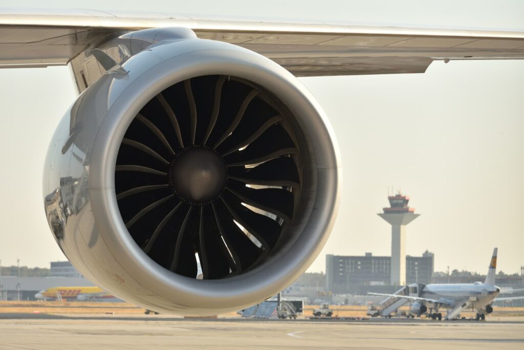 A jet engine on an airport tarmac