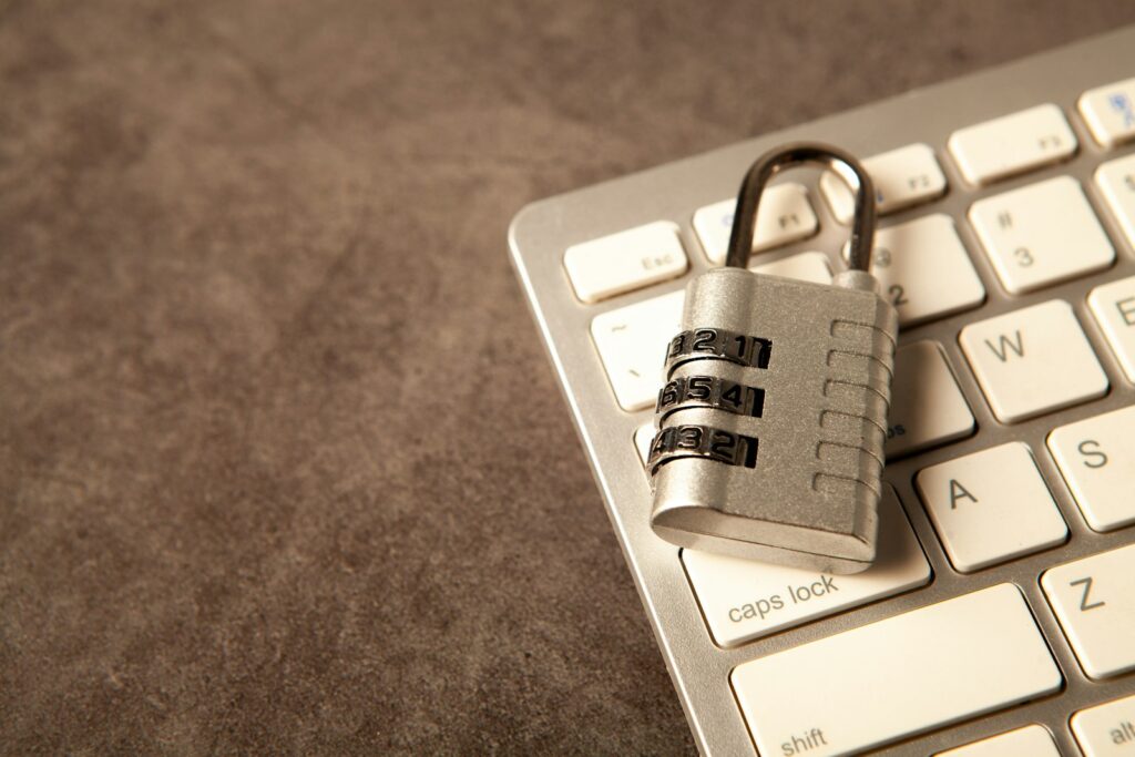 A padlock resting on a computer keyboard, representing endpoint security