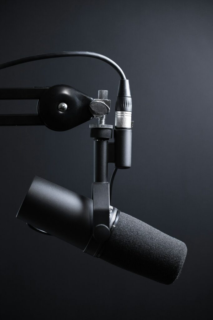Studio microphone on a stand, representing creator content production