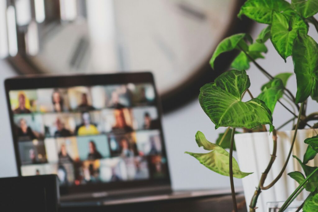Laptop showing a video call, representing webinars and content production