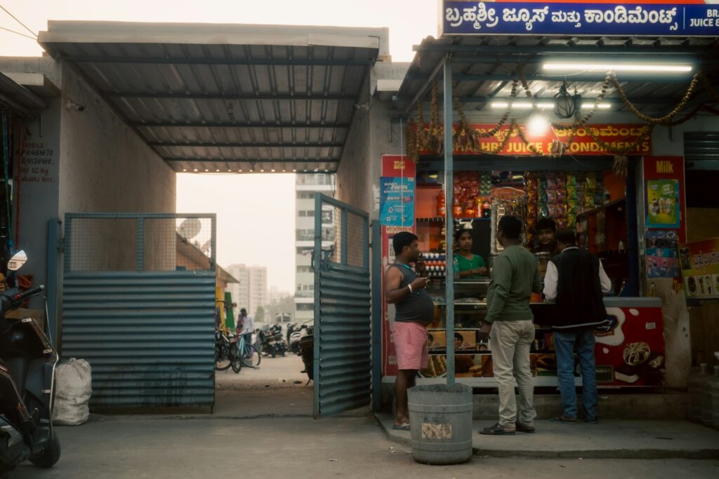 People gathered outside a small shop in India