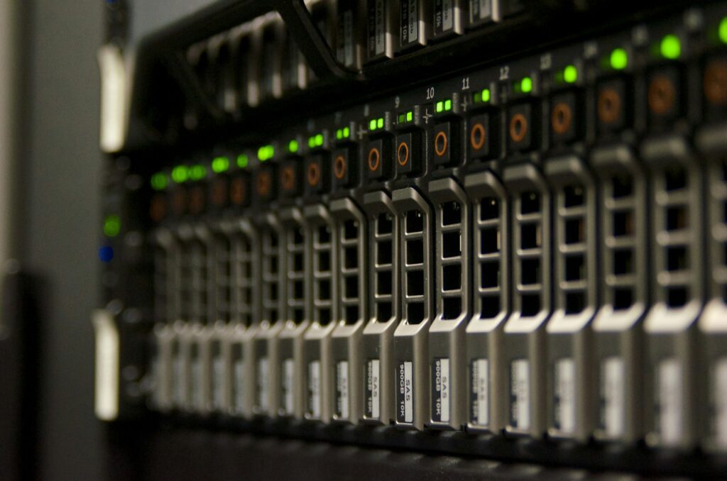 A server rack with blinking green status lights in a data centre