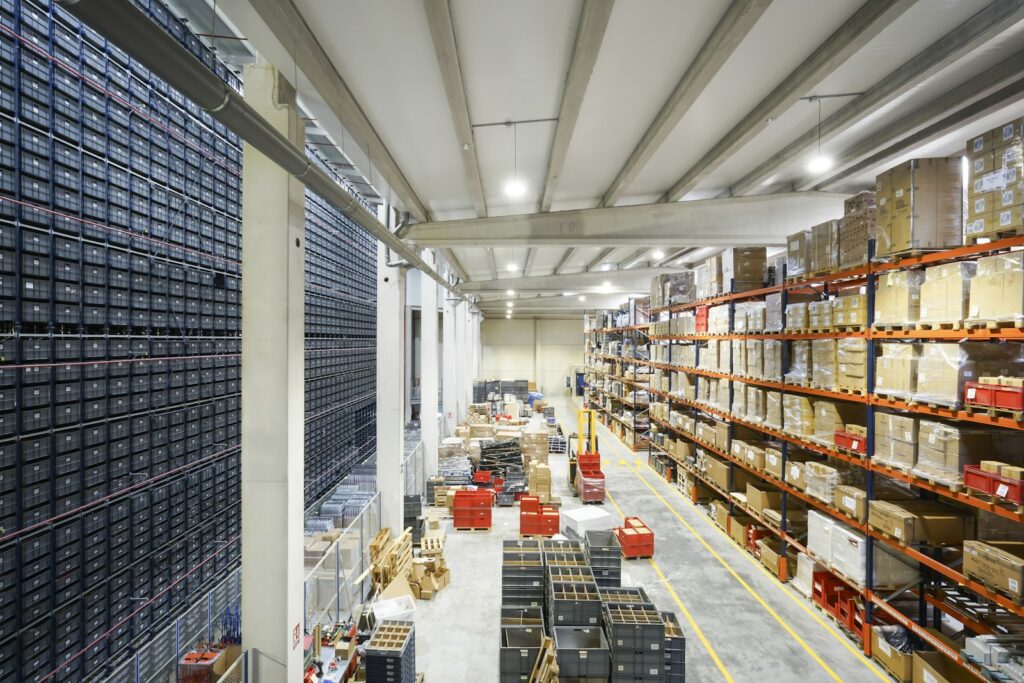 A large distribution warehouse filled with stacked boxes