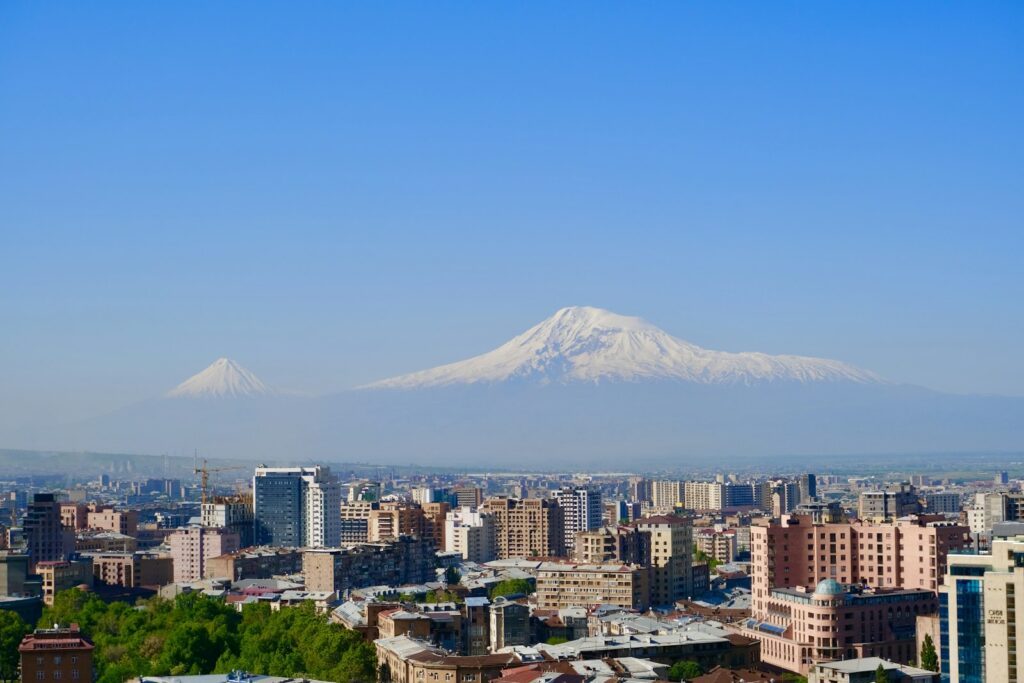 The Yerevan skyline in Armenia with a snow-covered mountain behind it