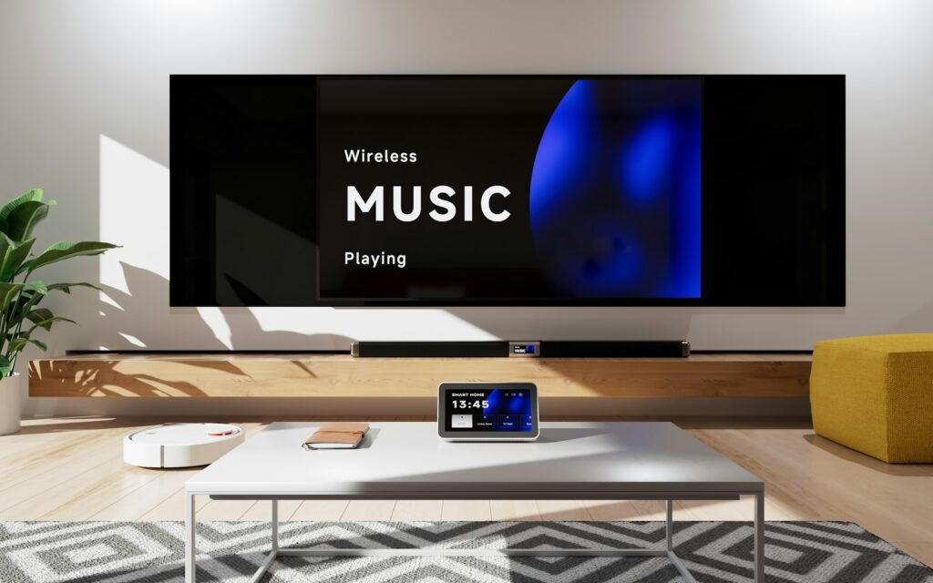 A living room with a big screen television and connected devices