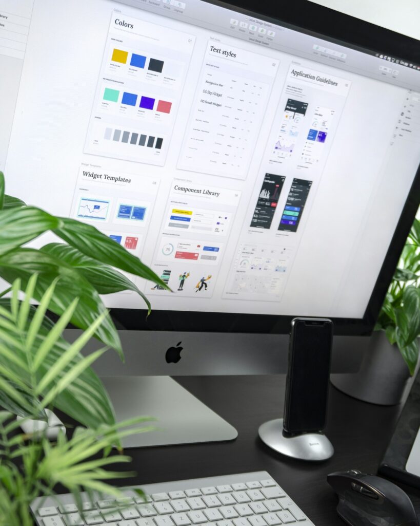 A computer monitor displaying a website design layout